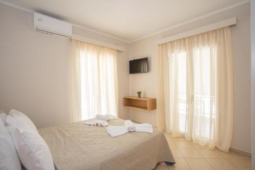 Postel nebo postele na pokoji v ubytování Melissa Zoe House