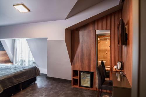 Ένα ή περισσότερα κρεβάτια σε δωμάτιο στο SennaCity Hotel