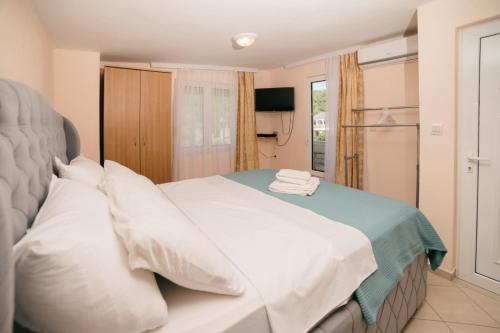 Postel nebo postele na pokoji v ubytování Monikas Village Appartments