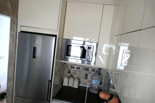 Kuchyň nebo kuchyňský kout v ubytování Apartamento Alhambra Mar