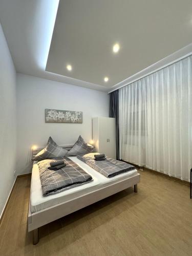 a bedroom with a large bed in a room at Micro Apartment Leipzig 2 in Leipzig