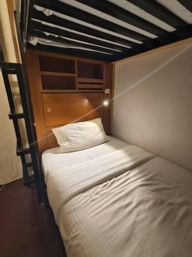 a bed in a small room with at Red Inn Court in George Town