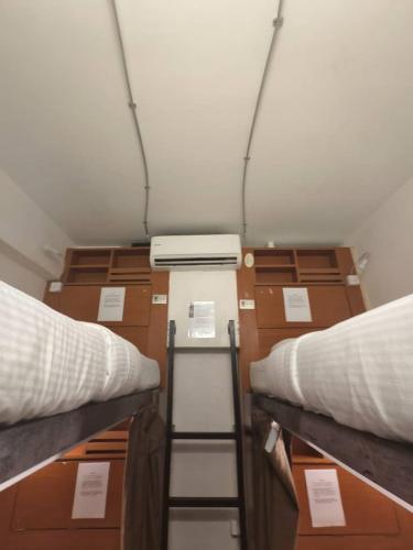a room with two beds and some boxes at Red Inn Court in George Town