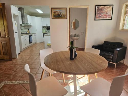 a living room with a table and chairs at Paradise in Whiteside