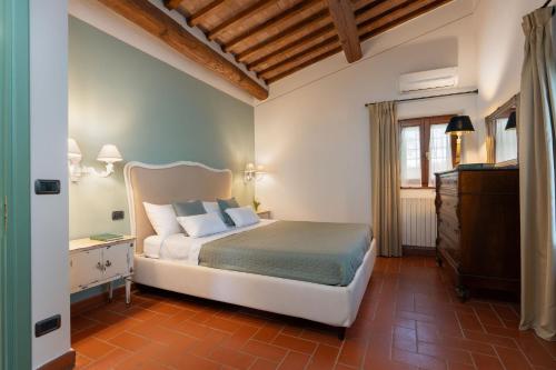 En eller flere senge i et værelse på A Casa Dell'ida