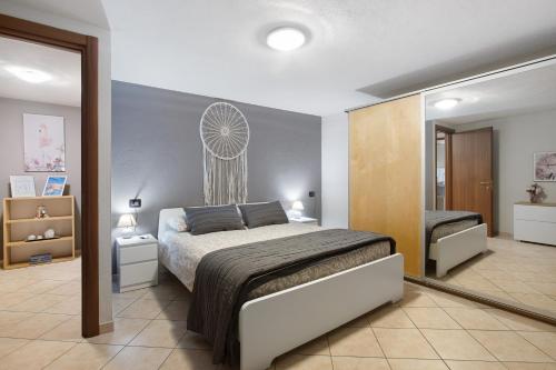 En eller flere senge i et værelse på Maison Bebe Comboé