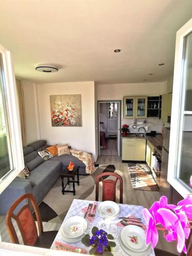 a living room with a couch and a table at Apartment Beba in Kaštela