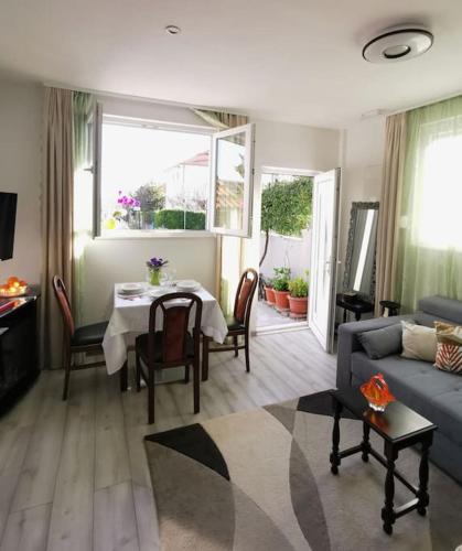 a living room with a table and a couch at Apartment Beba in Kaštela