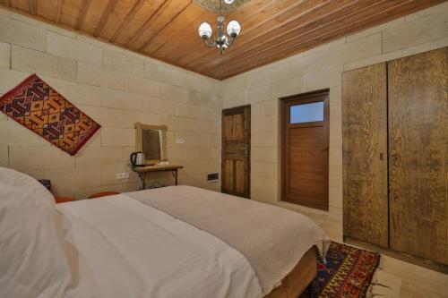 Postel nebo postele na pokoji v ubytování Asma Cave House