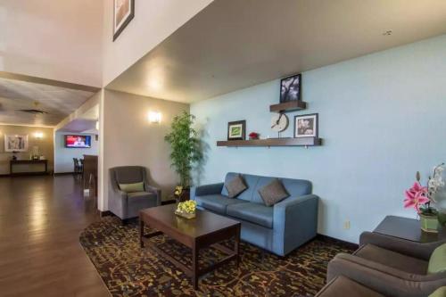 a living room with a couch and a table at Comfort Inn & Suites South in Calgary