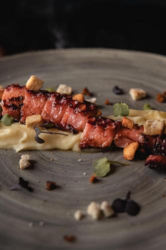 a plate with a piece of food on it at Ibiza Corso Hotel & Spa in Ibiza Town