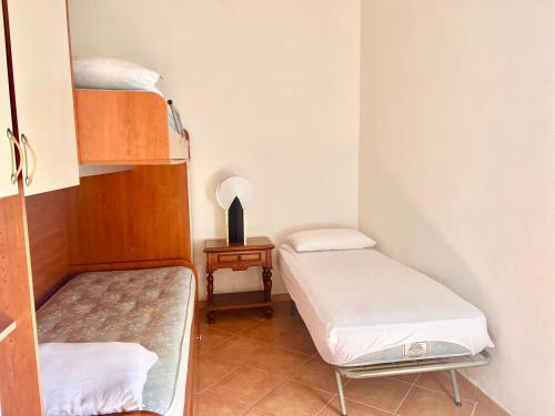 Postel nebo postele na pokoji v ubytování Lo Stazzu - Key to Villas