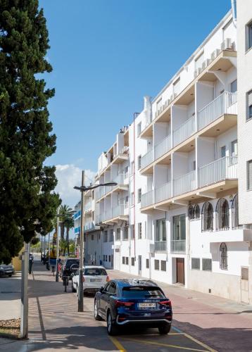 a car parked in front of a building at Hotel Playa in Peñíscola