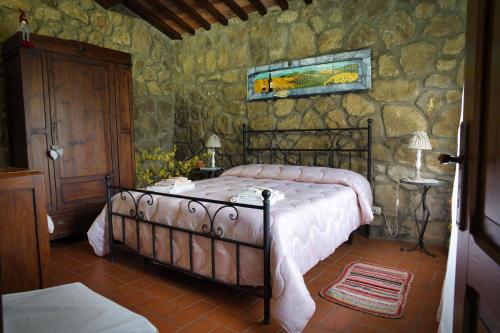A bed or beds in a room at Agriturismo Biagiotti