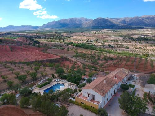 an aerial view of a villa in a valley with mountains at B&B Boutique Casa Clavi in Chirivel