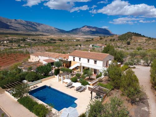 an aerial view of a house with a swimming pool at B&B Boutique Casa Clavi in Chirivel