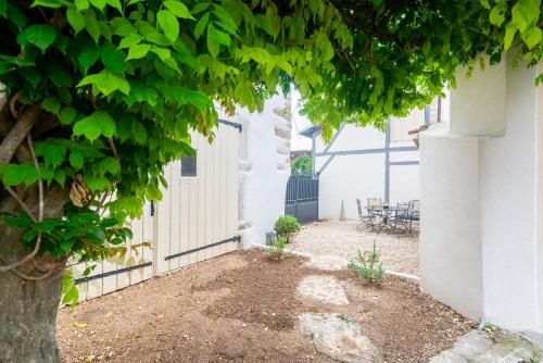 a courtyard of a house with a tree at La maison du Clos, 2 chambres au calme in Marsannay-la-Côte