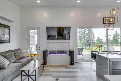 a living room with a couch and a fireplace at Hot Tub and Views Sunset Valley Retreat in Eureka in Eureka