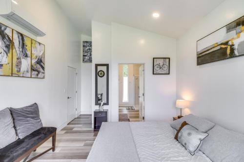 a white bedroom with a bed and a couch at Hot Tub and Views Sunset Valley Retreat in Eureka in Eureka