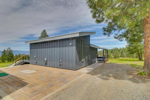 a gray garage with a tree in front of it at Hot Tub and Views Sunset Valley Retreat in Eureka in Eureka