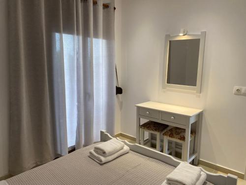Кровать или кровати в номере Giannis house 2