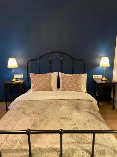 a bedroom with a large bed with two lamps on tables at Sapphire Suites Taksim in Istanbul