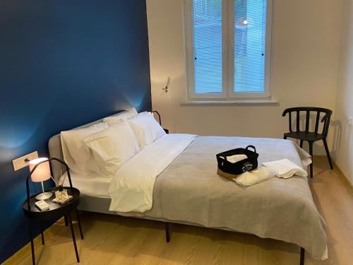 a bedroom with a bed with a black bag on it at Sapphire Suites Taksim in Istanbul