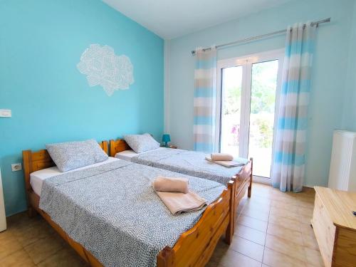 Postel nebo postele na pokoji v ubytování Corfiota Sourina