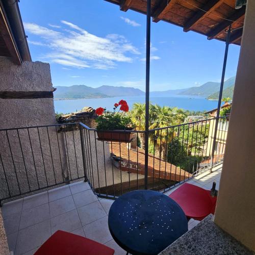 a balcony with a view of the ocean at Borgo Paradiso Guest House in Maccagno Inferiore
