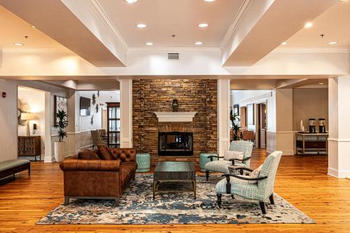 a living room with a couch and a fireplace at Hampton Inn & Suites Charleston-West Ashley in Charleston