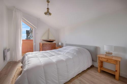 En eller flere senge i et værelse på Sur le quai de Pornic, Appartement pour 4