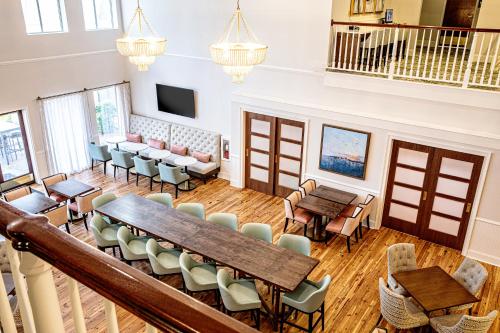a large room with tables and chairs and a table at Hampton Inn & Suites Charleston-West Ashley in Charleston