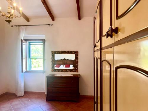 Postel nebo postele na pokoji v ubytování Lo Stazzu - Key to Villas