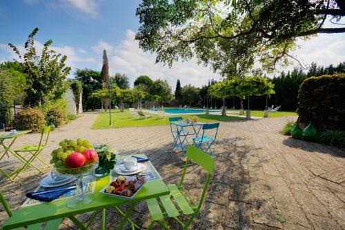 a table with a bowl of fruit on it at Tenuta Sant'Andrea in Muro Leccese