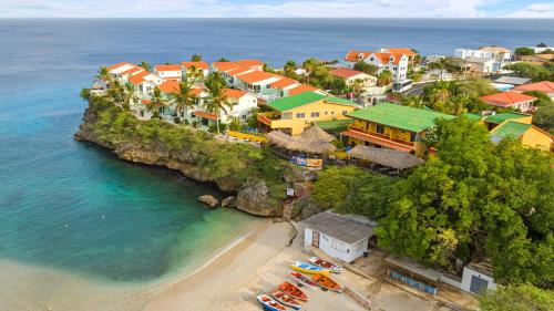 an aerial view of a town on a beach at Bahia Apartments & Diving in Lagun