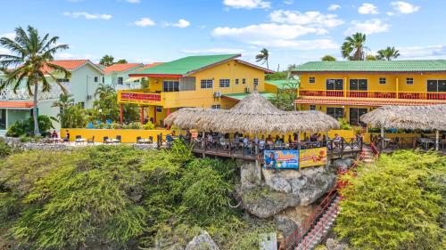 a group of people sitting at a train station at Bahia Apartments & Diving in Lagun