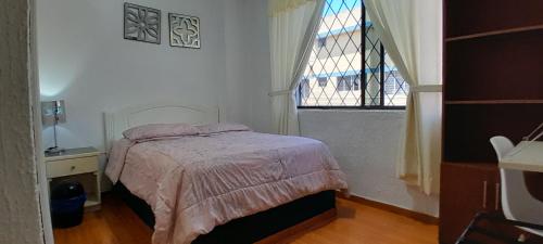 Ein Bett oder Betten in einem Zimmer der Unterkunft Hostal Brilliant