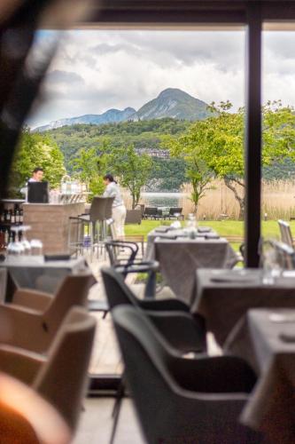 a view of a restaurant with tables and chairs at Villa Caroline, Lac d'Annecy in Duingt