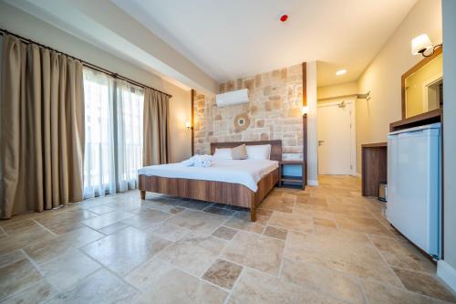 Postel nebo postele na pokoji v ubytování Selimiye Thales Otel