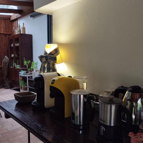 a counter top with pots and pans on a table at Petalo Rosso b&b in Lenola