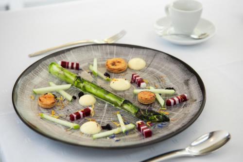a plate of candy melts and marshmallows on a table at Mondorf Parc Hotel & Spa in Mondorf-les-Bains