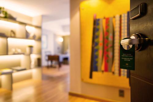 a door with a bunch of books hanging on a wall at Kubitschek Plaza Hotel in Brasilia