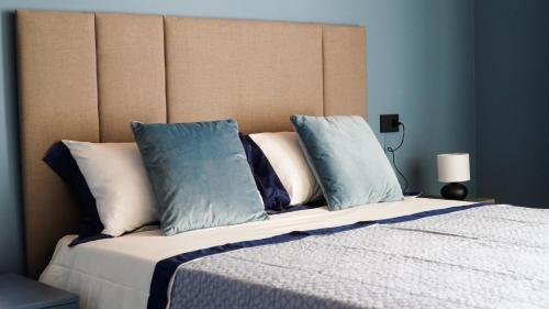 En eller flere senge i et værelse på CALA Appartamenti