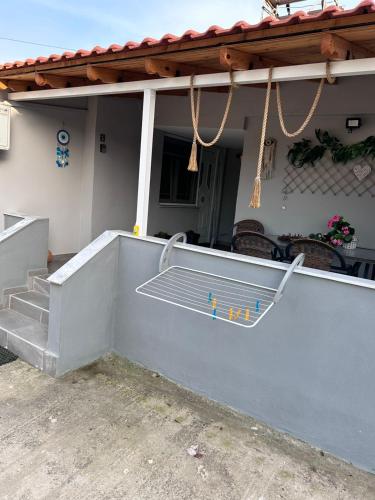 a stair railing on a porch of a house at Amaya Pine Rooms in Keramotí