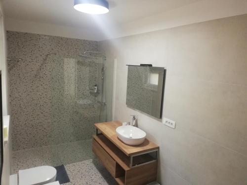 a bathroom with a sink and a shower at Luxury Seaview Apartment with private pool in Kostrena