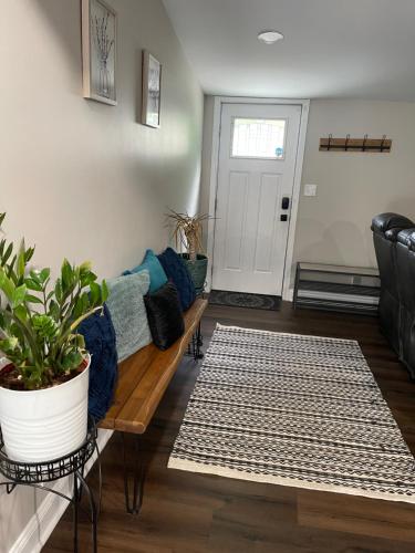 a living room with a couch and a table at Serenity away from the big city in Amelia