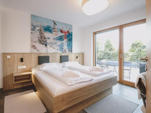 Posteľ alebo postele v izbe v ubytovaní First IN Mountain Chalets by we rent