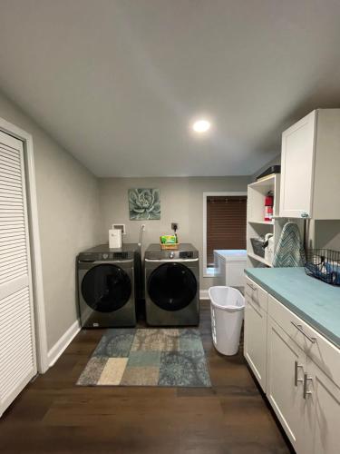 a laundry room with a washer and dryer in it at Serenity away from the big city in Amelia