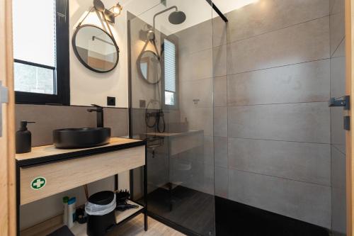 a bathroom with a shower and a sink at The View Flat in Funchal