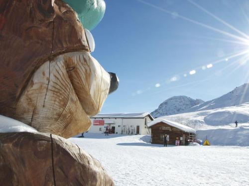 a statue of a teddy bear in the snow at Chalet Jean in Grimentz